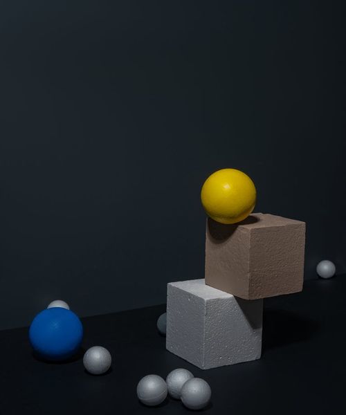 Neon glowing sphere inside a dark obsidian cube